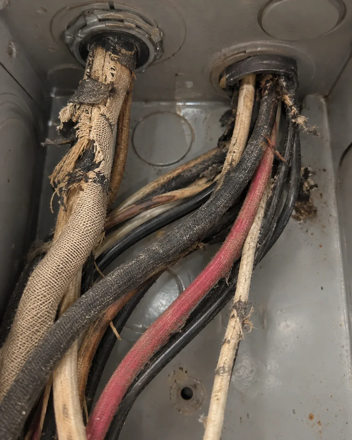 Close-up of older cloth wiring with fabric-style insulation
