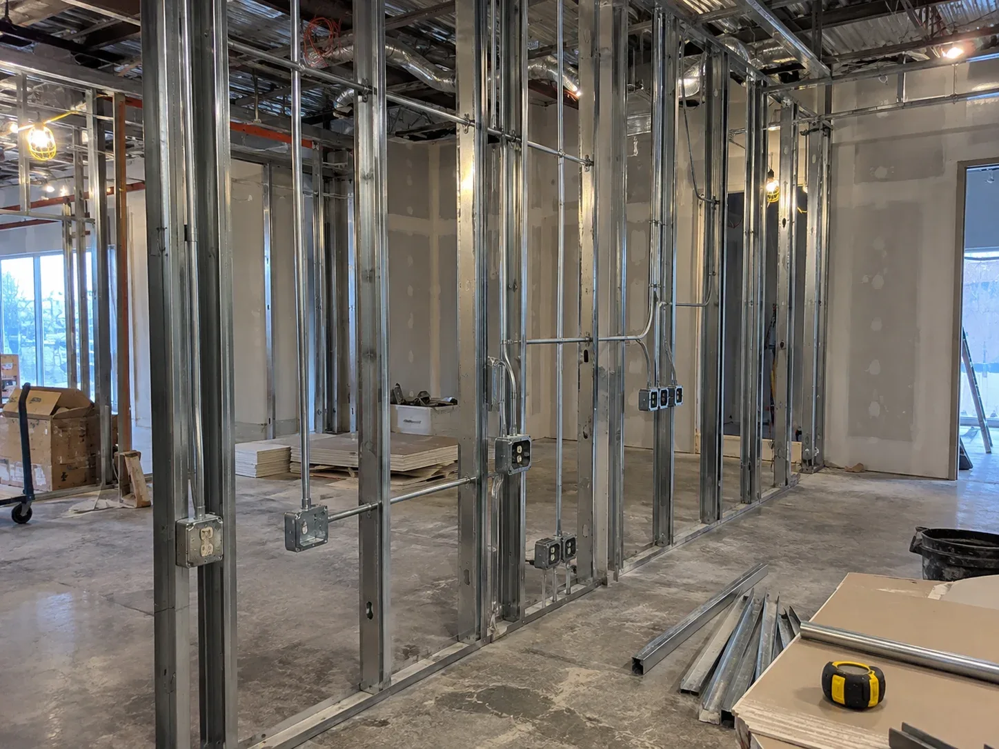New commercial construction electrical rough-in with exposed ceiling conduits